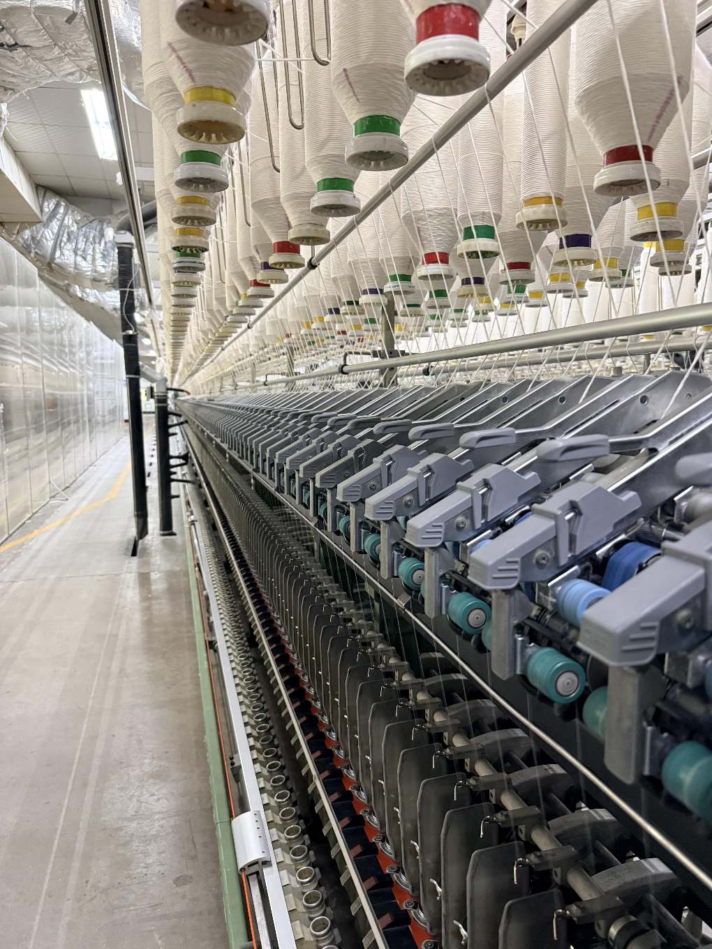 Yarn spools on a factory floor